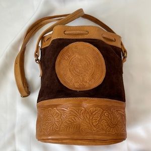 Handmade leather bucket purse. Aztec calendar and floral design.